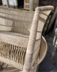 Zoomed-in view showcasing the craftsmanship and tight cane weave on a natural Malawi chair’s backrest and seat.