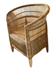 A handmade Malawi chair in natural finish, photographed at an angle to highlight the smooth curvature and intricate weaving.