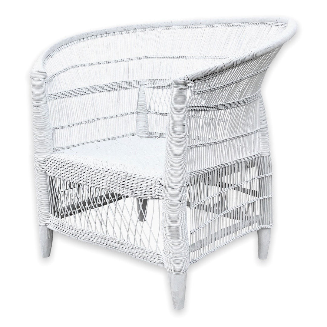 Angled view of a white Malawi Cane Chair – Highlighting the curved shape and detailed artisan weaving from the front-right perspective.