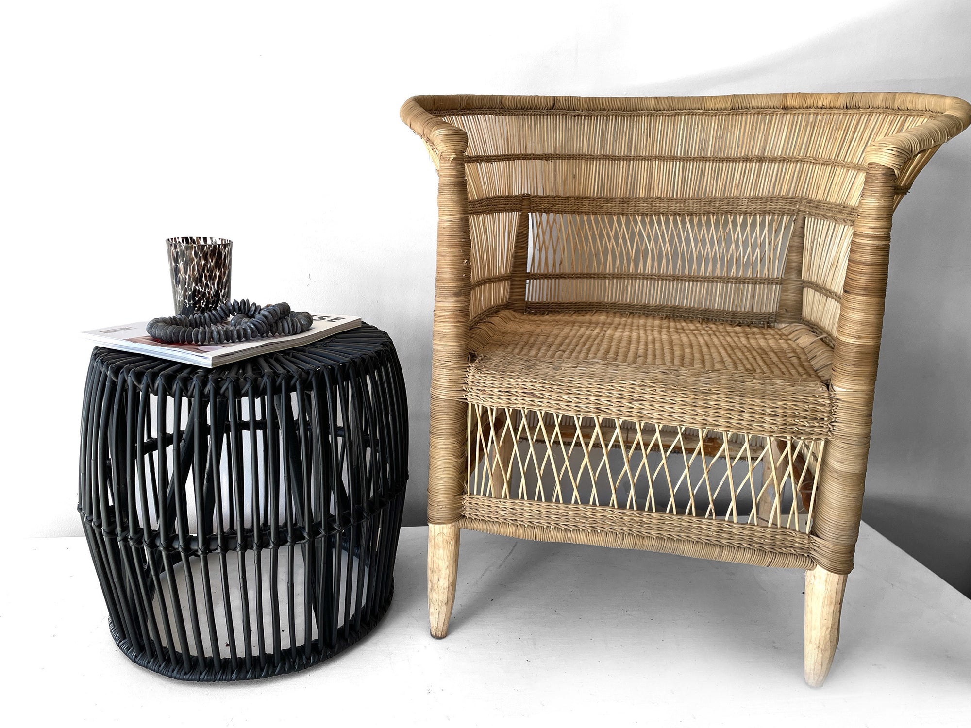 Malawi Chair in Natural– styled with matching black side table.
