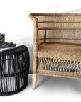 Malawi Chair in Natural– styled with matching black side table.